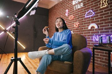 a woman recording herself with a smartphone