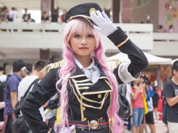 saluting woman in costume