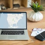 macbook pro on brown wooden table